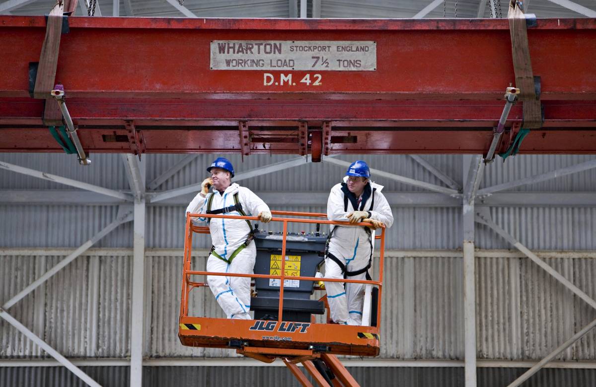 2 Jgc Engineering Engineers working on a cherry picker to review bespoke fabrication work