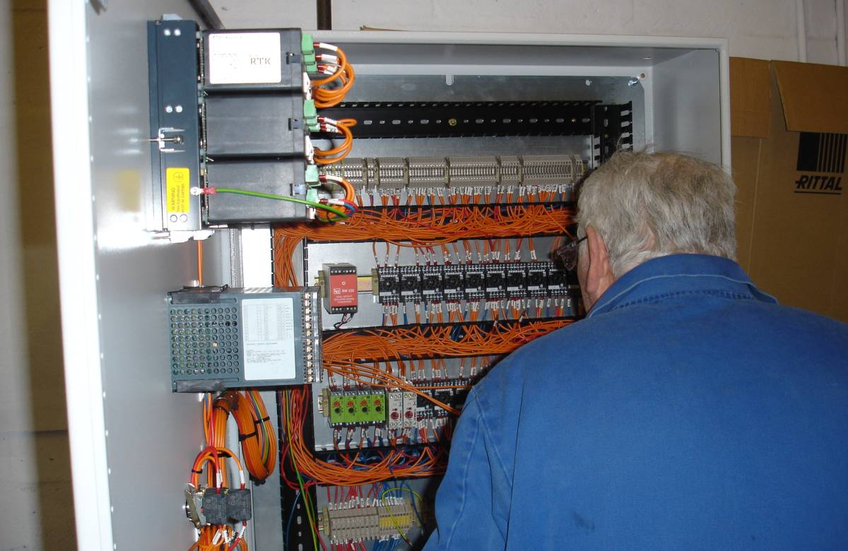 One of JGC Engineering's Technicians and Engineers commissioning an ECI panel on site