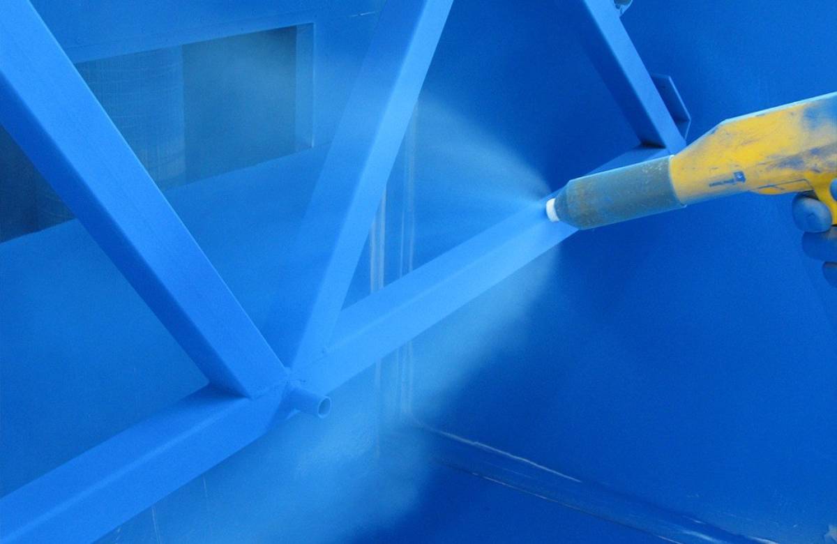 JGC Engineering engineer applying a surface coating to bespoke steel structure for clients